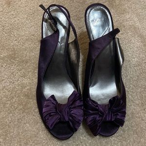 Woman’s purple dress shoe.